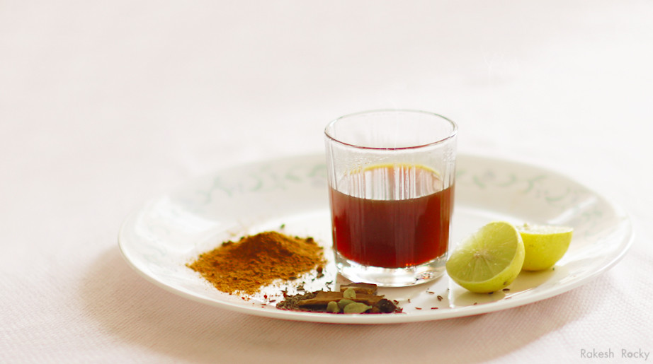 Chai in a glass with spices and red chili powder