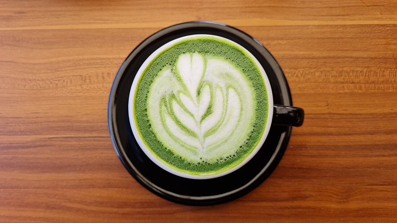 A matcha latte with rosetta latte art