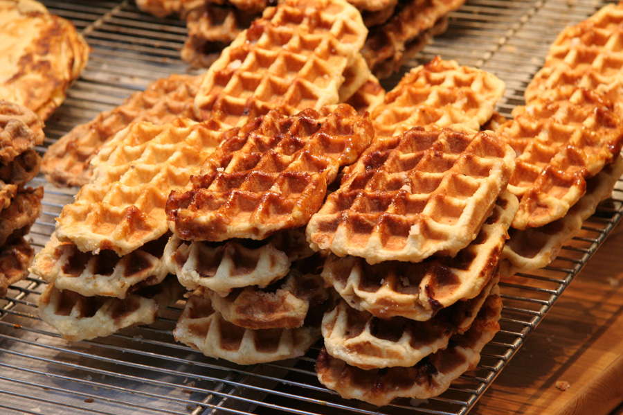 Glazed Liège waffles cooling on a rack