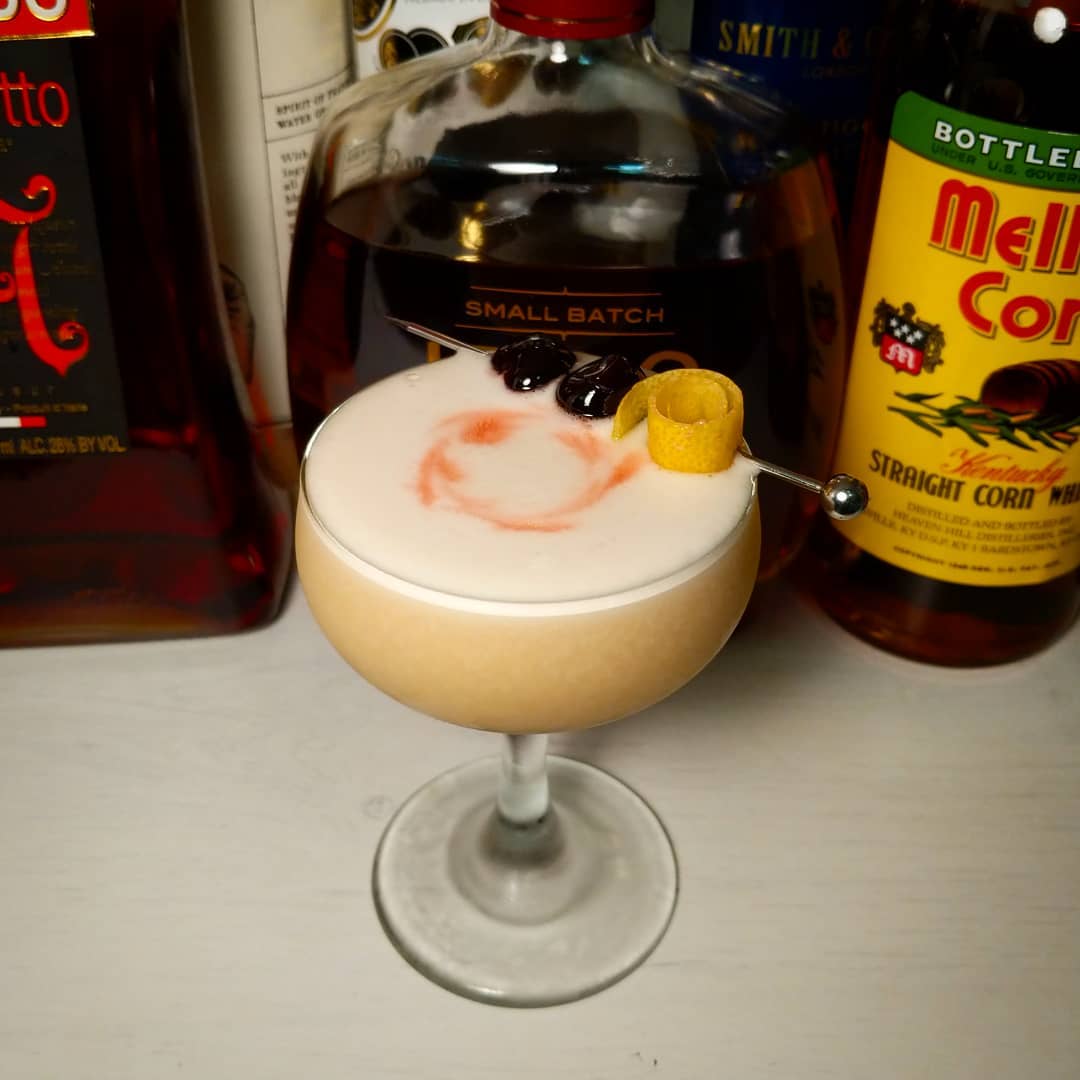 A silky foam-topped sour in a coupe
